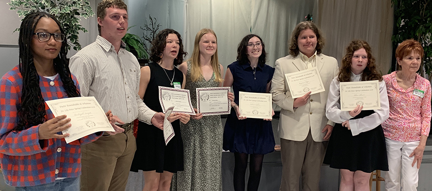 Collegiate and student contest winners with Arkansas Poet Laureate Suzanne Rhodes